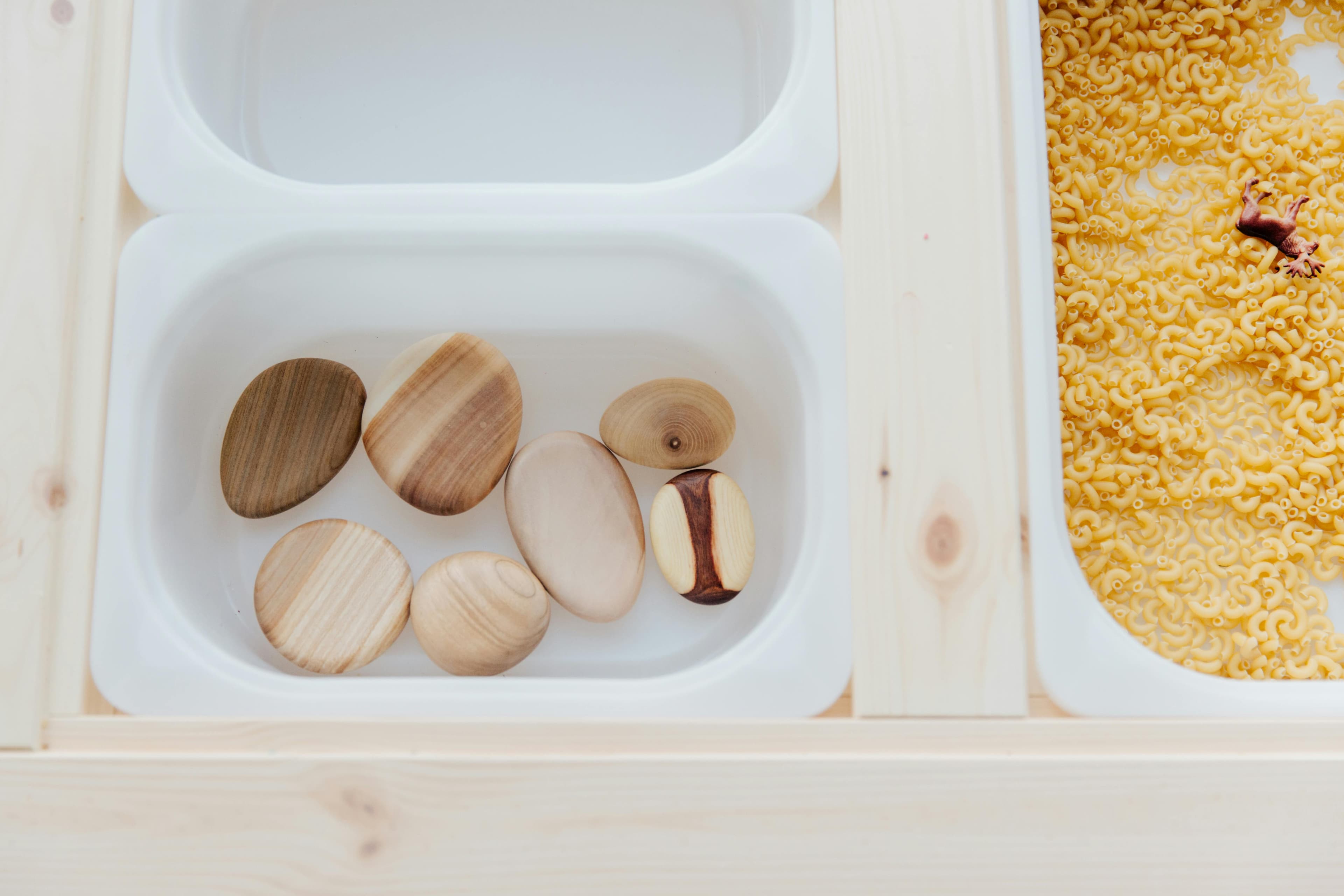 Drop cloth or tarp laid under a sensory bin setup