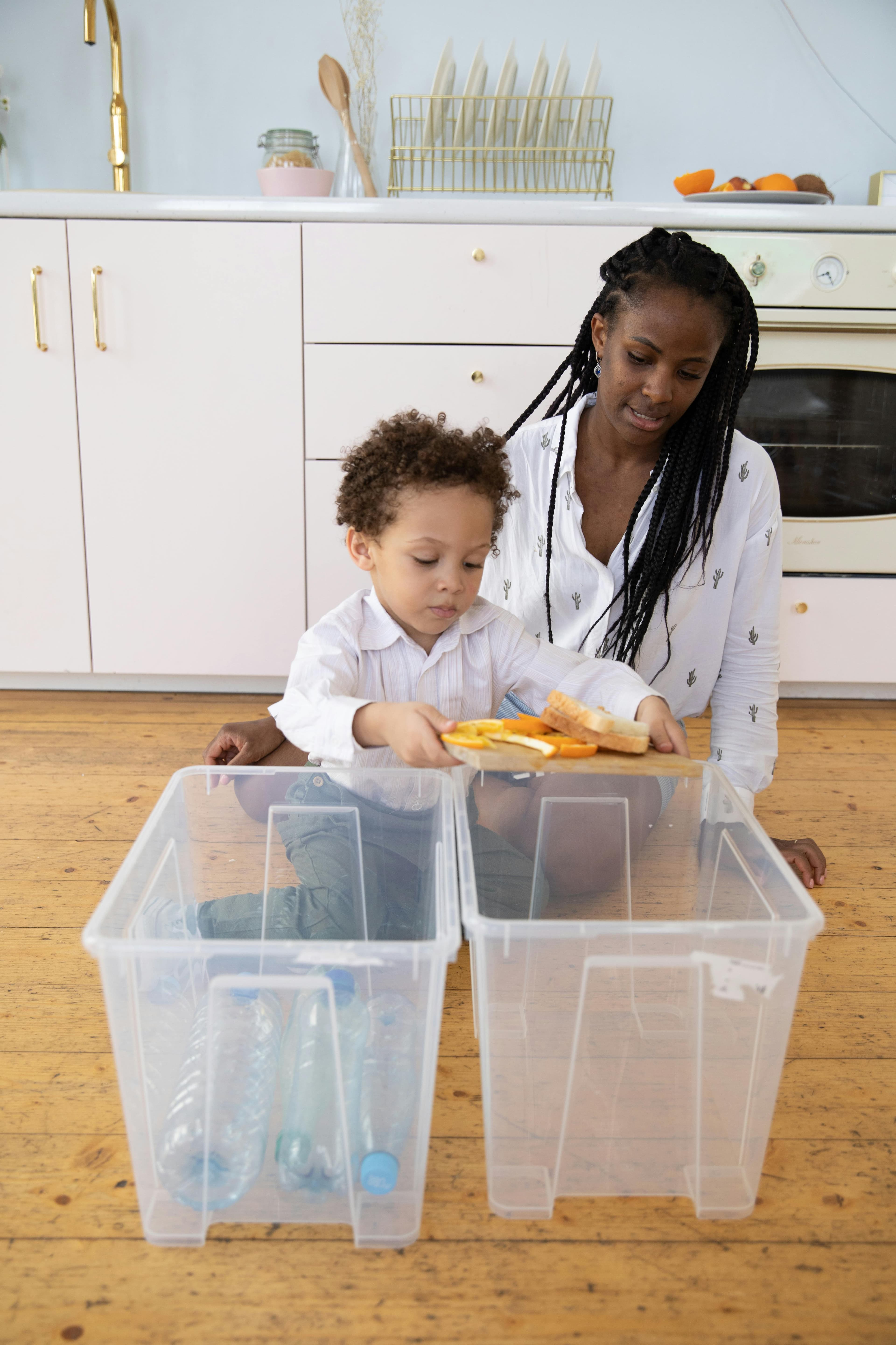 Child digging in a sensory bin with a trowel for hidden treasure