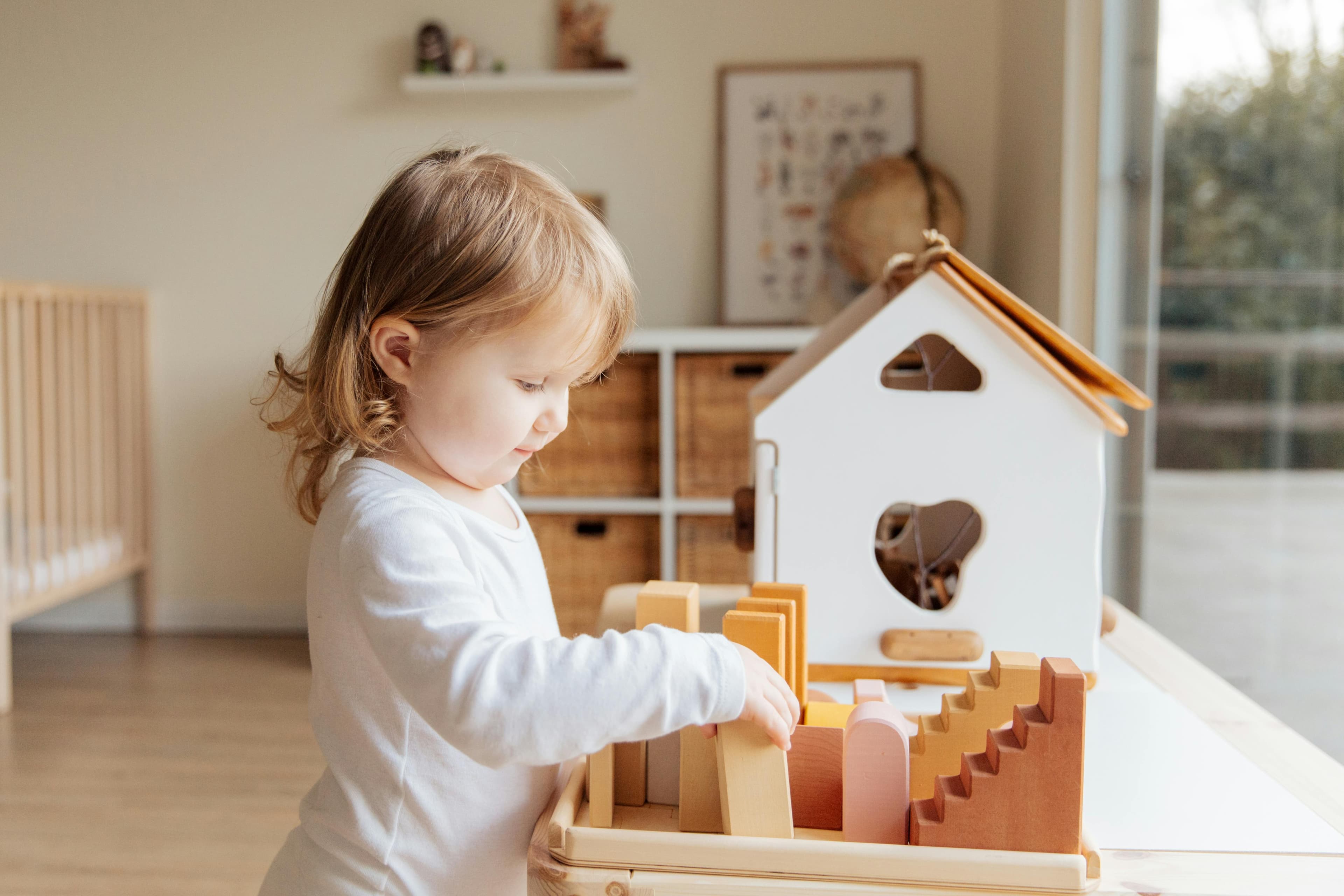 Child digging through sensory base with a trowel