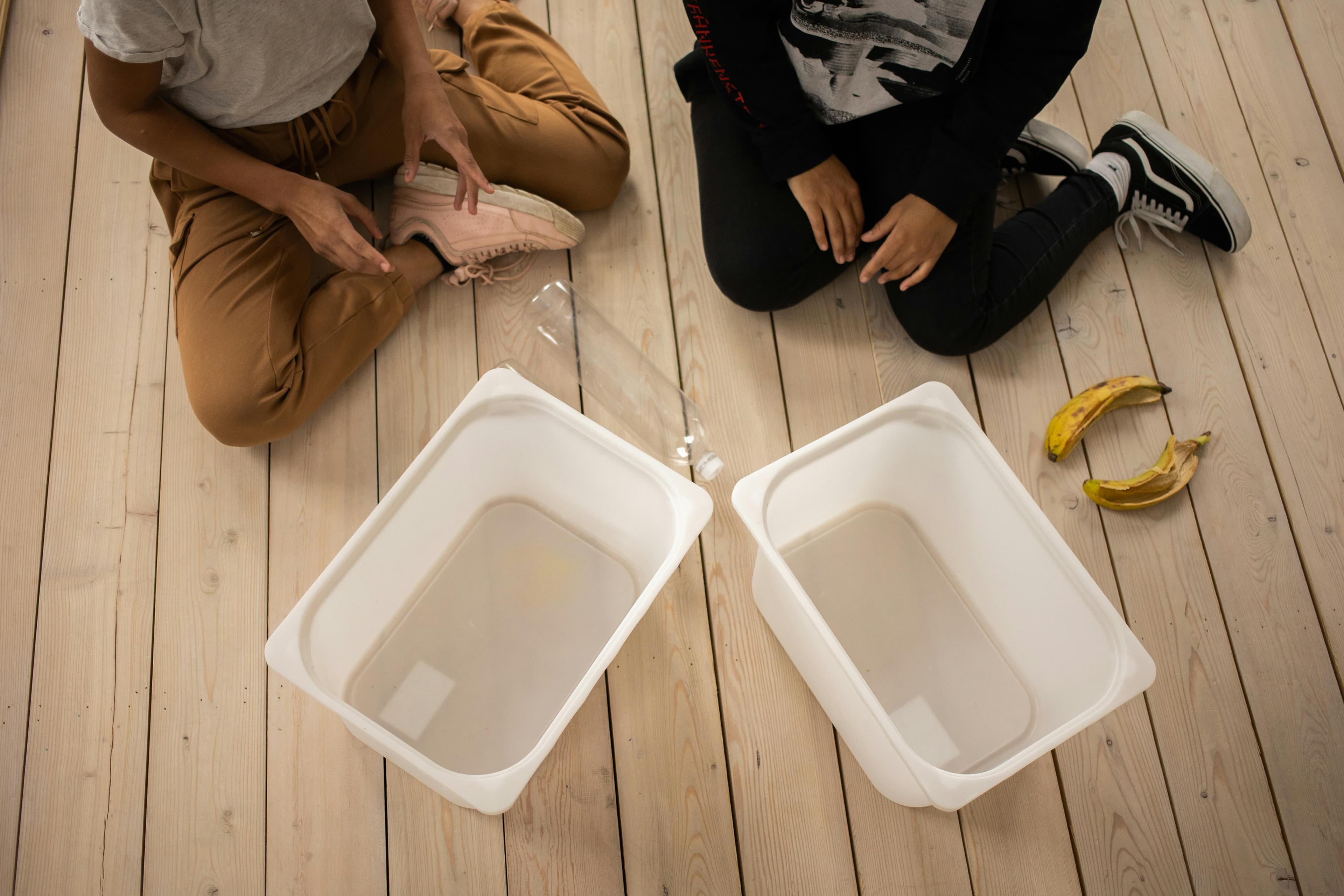 Paint roller tray used for pour-and-catch sensory play